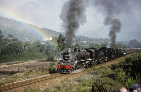 South African Railway steam locomotives nos. 2683 and 4122 pass a vibrant rainbow in Camfer, Western Cape, South Africa, on March 23, 1995. Photograph by Fred M. Springer, © 2014, Center for Railroad Photography and Art. Springer-So.Africa(1)-16-10