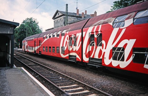 A "Coca-Cola" painted train moves through the station in Blankenberg, Czech Republic, on May 28, 1993. Photograph by Fred M. Springer, © 2014, Center for Railroad Photography and Art. Springer-Europe-14-39