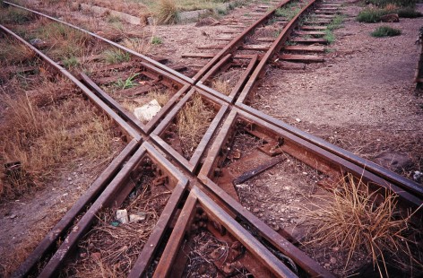 Tracks of two gauges, 2' and 3' 6", intersect in Port Elizabeth, Eastern Cape, South Africa, on March 25, 1995. Photograph by Fred M. Springer, © 2014, Center for Railroad Photography and Art. Springer-So.Africa(1)-20-17
