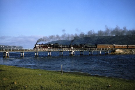 South African Railway steam locomotives cross the Knysna Lagoon in Knysna, Western Cape, South Africa, on March 22, 1995. Photograph by Fred M. Springer, © 2014, Center for Railroad Photography and Art. Springer-So.Africa(1)-16-35