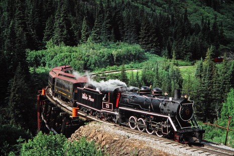 White Pass and Yukon Route steam locomotive no. 73 crosses a curved wooden trestle in Glacier, British Columbia, Canada, on June 13, 1998. Photograph by Fred M. Springer, © 2014, Center for Railroad Photography and Art. Springer-Alaska-NZ-10-30