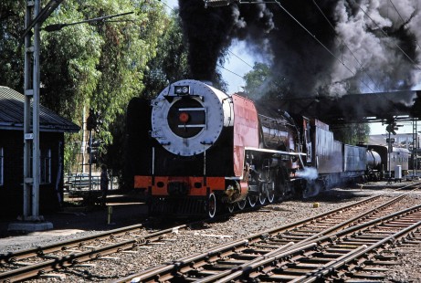 South African Railway 4-8-4 steam locomotive no. 3417 pulls up to a small yard building in De Aar, Northern Cape, South Africa, on April 1, 1995. Photograph by Fred M. Springer, © 2014, Center for Railroad Photography and Art. Springer-So.Africa-NOR-SWE-04-13