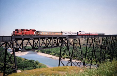 Canadian Pacific Railway diesel locomotive no. 3110 with a five-car passenger train nears the end of the Lethbridge Viaduct crossing in Lethbridge, Alberta, Canada, on July 8, 2003. Photograph by Fred M. Springer, © 2014, Center for Railroad Photography and Art. Springer-Canada-NZ(1)-03-16
