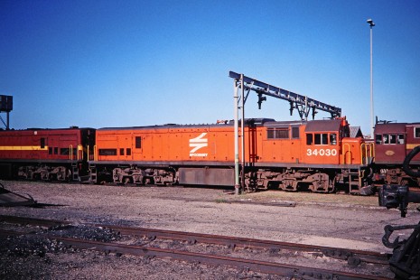South African Railway (formerly Spoornet) diesel locomotive no. 34030 in Voorbaai, Western Cape, South Africa, on March 21, 1995. Photograph by Fred M. Springer, © 2014, Center for Railroad Photography and Art. Springer-So.Africa(1)-14-21