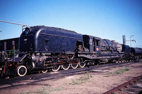 South African Railway steam locomotive no. 4122 or "Jenny" waits in the train yard in Voorbaai, Western Cape, South Africa, on March 21, 1995. Photograph by Fred M. Springer, © 2014, Center for Railroad Photography and Art. Springer-So.Africa(1)-14-22