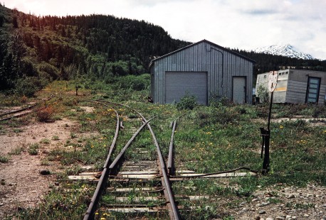 An overgrown stub switch point on the White Pass & Yukon Railroad in Bennett, British Columbia, Canada, on June 13, 1998. Photograph by Fred M. Springer, © 2014, Center for Railroad Photography and Art. Springer-Alaska-NZ-11-25