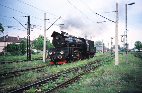 A Polskie Koleje Państwowe (Polish State Railways) 2-6-2 steam locomotive and its driver on the overgrown tracks in Wolsztyn, Greater Poland, Poland, on May 21, 1993. Photograph by Fred M. Springer, © 2014, Center for Railroad Photography and Art. Springer-Europe-04-10