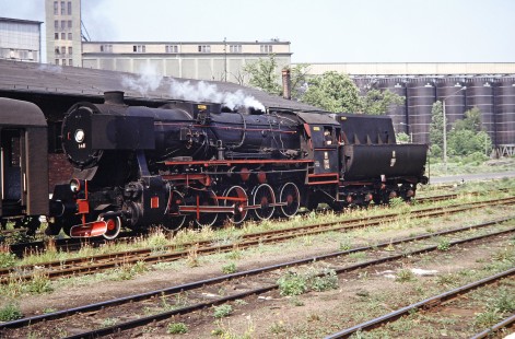 Polskie Koleje Państwowe (Polish State Railways) 2-10-0 steam locomotive no. Ty42-148 outside a factory station in Grodzisk, Greater Poland, Poland, on May 20, 1993. Photograph by Fred M. Springer, © 2014, Center for Railroad Photography and Art. Springer-Europe-01-04