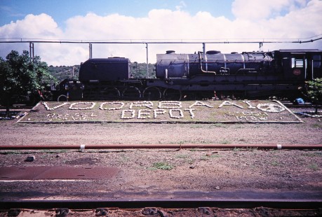 Rock sign for Voorbaai Depot and South African Railway Garratt steam locomotive no. 4122 in Voorbaai, Western Cape, South Africa,on March 20, 1995. Photograph by Fred M. Springer, © 2014, Center for Railroad Photography and Art. Springer-So.Africa(1)-11-03