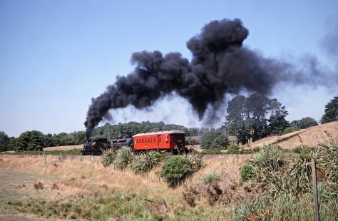 Glenbrook Vintage Railway steam locomotive no. 847 produces a dramatic plume of smoke along the tracks in Glenbrook, New Zealand, on January 29, 1994. Photograph by Fred M. Springer, © 2014, Center for Railroad Photography and Art. Springer-NZ-UK-02-33