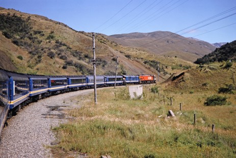 Trans Alpine diesel locomotive no. 5206 hauls a passenger train toward the town of Craigieburn in Greymouth, West Coast, New Zealand, on January 17, 1994. Photograph by Fred M. Springer, © 2014, Center for Railroad Photography and Art. Springer-NZ(1)-12-26