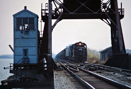 Westbound Conrail freight train crossing Bay Bridge in Danbury, Ohio, on October 22, 1977. Photograph by John F. Bjorklund, © 2016, Center for Railroad Photography and Art. Bjorklund-81-01-21