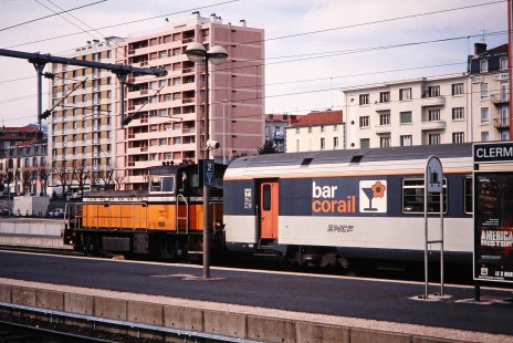 National Society of French Railways diesel locomotive no. 8358 pulls a bar corail car away from Clermont-Ferrand station in Clermont-Ferrand, France, on March 1, 1999. Photograph by Fred M. Springer, © 2014, Center for Railroad Photography and Art. Springer-FRA-SD&AE-C&TS(1)-02-26