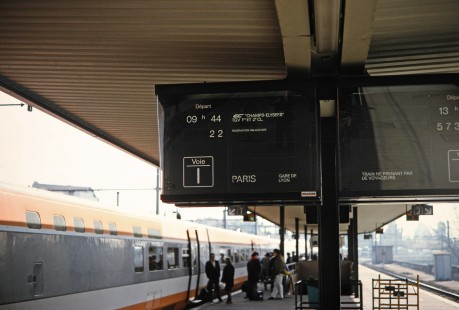 A close-up of the train departure sign for the National Society of French Railways TGV train to Paris as it leaves Dijon, Bourgone Region, France, on March 17, 1992. Photograph by Fred M. Springer, © 2014, Center for Railroad Photography and Art. Springer-ZimZam(2)-Swiss-13-15