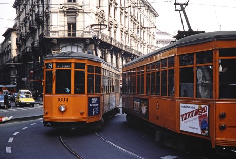One streetcar no. 1634 heads to Rosiero and another moves quickly forward on the rails in Milan, Lombardy, Italy, on March 11, 1992. Photograph by Fred M. Springer, © 2014, Center for Railroad Photography and Art. Springer-ZimZam(2)-Swiss-07-08