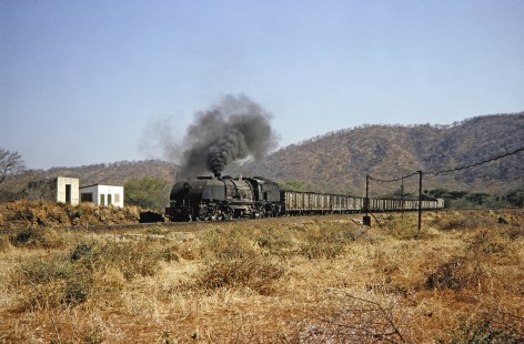 National Railways of Zimbabwe Garratt steam locomotive no. 185 near Lukosi, Zimbabwe on August 6, 1991. Photograph by Fred M. Springer, © 2014, Center for Railroad Photography and Art. Springer-ZimZam(2)-Swiss-19-32