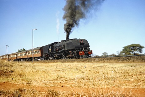 National Railways of Zimbabwe Garratt steam locomotive no. 417 tilts slightly on a super-elevated curve near Bulawayo, Zimbabwe, on August 4, 1991. Photograph by Fred M. Springer, © 2014, Center for Railroad Photography and Art. Springer-Hedjaz-ZimZam(1)-21-20