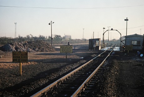 Warning signs on the approach to the turntable in Bulawayo, Zimbabwe, on August 1, 1991. Photograph by Fred M. Springer, © 2014, Center for Railroad Photography and Art. Springer-Hedjaz-ZimZam(1)-18-33