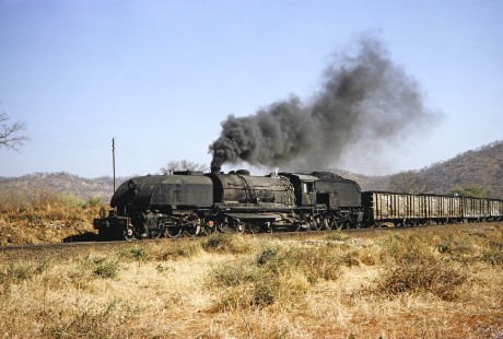 National Railways of Zimbabwe Garratt steam locomotive no. 185 with a coal train in Hwange, Matabeleland, Zimbabwe, on August 6, 1991. Photograph by Fred M. Springer, © 2014, Center for Railroad Photography and Art. Springer-Hedjaz-ZimZam(1)-24-29