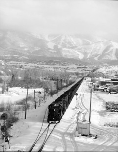Westbound Denver and Rio Grande Western Railroad (DRGW) locomotive #5380 hauling an empty coal train through Steamboat Springs, Colorado, in December, 1992. Photograph by Robert A. Hadley. © 2016, Center for Railroad Photography and Art