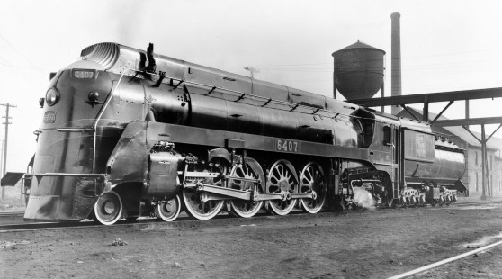Grand Trunk Western Railroad 4-8-4 steam locomotive #6407 in Chicago, Illinois, 1941. A water tank is visible behind the locomotive. Photograph by Robert A. Hadley.  © 2016, Center for Railroad Photography and Art