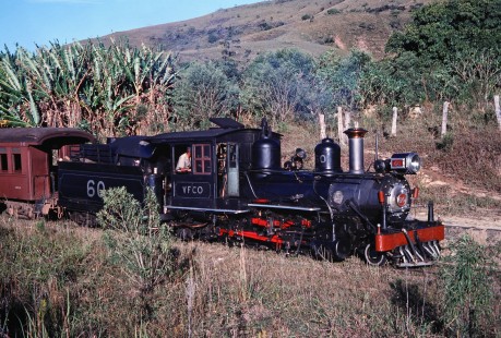 The engineer of the VFCO narrow-gauge steam locomotive no. 60 pays attention to the track in Antonio Carlos, Santa Catarina, Brazil, on May 30, 1976. Photograph by Fred M. Springer, © 2014, Center for Railroad Photography and Art. Springer-PA-BR-SOAM-ME-ARG2-10-04