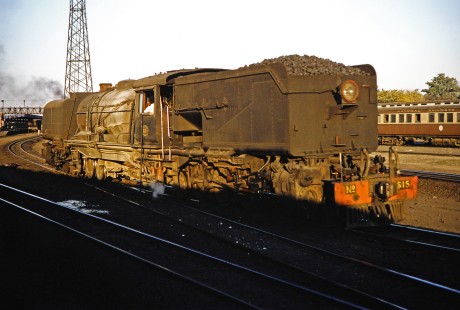 National Railways of Zimbabwe Garratt steam locomotive no. 615 fully loaded with coal in the yard in Bulawayo, Zimbabwe, on August 2, 1991. Photograph by Fred M. Springer, © 2014, Center for Railroad Photography and Art. Springer-Hedjaz-ZimZam(1)-19-36