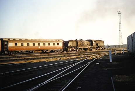 A Garratt steam locomotive moves a National Railways of Zimbabwe passenger train in Bulawayo, Zimbabwe, on August 1, 1991. Photograph by Fred M. Springer, © 2014, Center for Railroad Photography and Art. Springer-Hedjaz-ZimZam(1)-17-23