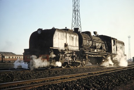 National Railways of Zimbabwe Garratt steam locomotive no. 524 surrounded by shadows and steam clouds in Bulawayo, Zimbabwe, on August 1, 1991. Photograph by Fred M. Springer, © 2014, Center for Railroad Photography and Art. Springer-Hedjaz-ZimZam(1)-17-29