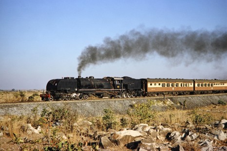 National Railways of Zimbabwe Garratt steam locomotive no. 608 pulls a passenger train near Bulawayo, Zimbabwe, on August 2, 1991. Photograph by Fred M. Springer, © 2014, Center for Railroad Photography and Art. Springer-Hedjaz-ZimZam(1)-19-16