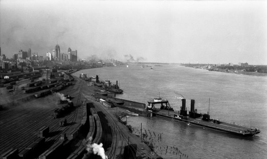 View looking east of rail yard in Detroit, Michigan, circa 1935. The Detroit River and the Wabash car ferry <i>Manitowoc</i> are visible to the right of the yard.  Photograph by Robert A. Hadley. © 2016, Center for Railroad Photography and Art