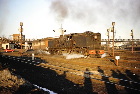 In the early morning light, National Railways of Zimbabwe Garratt steam locomotive no. 524 travels on the track in Bulawayo, Zimbabwe, on August 1, 1991. Photograph by Fred M. Springer, © 2014, Center for Railroad Photography and Art. Springer-Hedjaz-ZimZam(1)-17-21