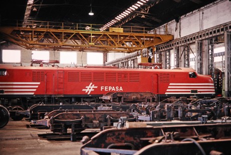 Ferrovia Paulista S.A. (later merged with RFFSA) electric locomotive no. 6153 is docked for repairs in the shops in Paulista, Sao Paulo, Brazil, on October 31, 1990. Photograph by Fred M. Springer, © 2014, Center for Railroad Photography and Art. Springer-PA-BR-SOAM-ME-ARG2-07-16