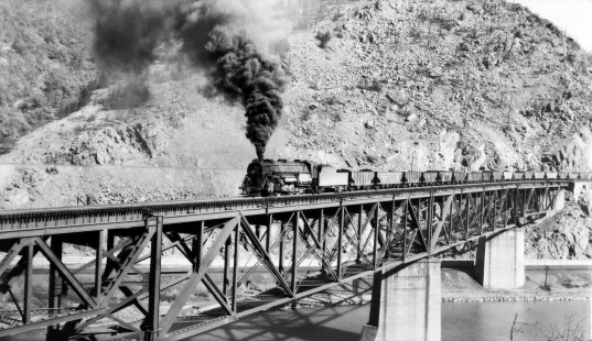 Lehigh & New England Railroad 2-10-2 steam locomotive #403 leading a westbound train of empty coal hoppers across the Lehigh River at the Lehigh Gap near Palmerton, Pennsylvania, in 1946. Photograph by Richard A. Hadley.  © 2017, Center for Railroad Photography and Art