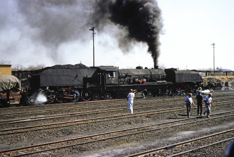 National Railways of Zimbabwe Garratt steam locomotive no. 418  at Thomson Junction, a railway marshaling yard about four miles northwest of Hwange in the Zimbabwe coal fields area on August 9, 1991. Photograph by Fred M. Springer, © 2014, Center for Railroad Photography and Art. Springer-ZimZam(2)-Swiss-22-19