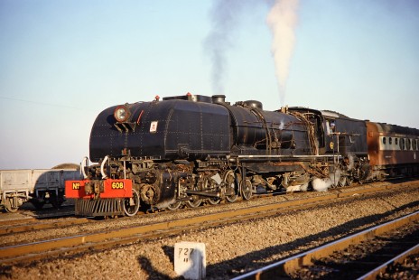 National Railways of Zimbabwe Garratt steam locomotive no. 608 waits before the 727 kilometer post near Bulawayo, Zimbabwe, on August 2, 1991. Photograph by Fred M. Springer, © 2014, Center for Railroad Photography and Art. Springer-Hedjaz-ZimZam(1)-19-22
