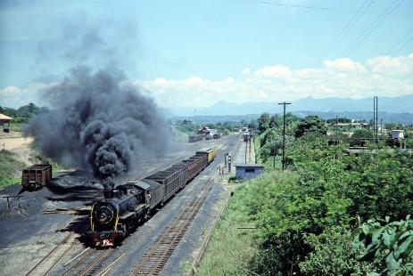 Rede Ferroviária Federal S.A. 2-10-2 steam locomotive no. 209 traverses across the track with an 8-car train as children look on in Paz Ferreira, Santa Catarina, Brazil, on October 28, 1990. Photograph by Fred M. Springer, © 2014, Center for Railroad Photography and Art. Springer-PA-BR-SOAM-ME-ARG2-03-13