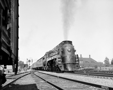 Grand Trunk Western Railway passenger train #17, <i> Inter-City Limited</i>, led by 4-8-4 locomotive #6409  in Durand, Michigan, 1940.  Union Station is visible behind the locomotive. Photograph by Robert A. Hadley. © 2016, Center for Railroad Photography and Art