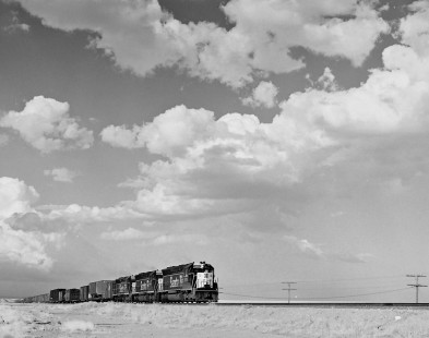 Atchison, Topeka and Sante Fe Railway (ATSF) freight train led by SD45 diesel locomotive no. 1871 in an unidentified location in the southwestern United States, circa 1970. Photograph by Robert A. Hadley. © 2016, Center for Railroad Photography and Art