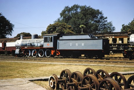 Zambesi Sawmills Railway steam locomotive no. 1126 sits at the Railway Museum in Livingstone, Southern Province, Zambia on August 7, 1991. Photograph by Fred M. Springer, © 2014, Center for Railroad Photography and Art. Springer-ZimZam(2)-Swiss-20-30