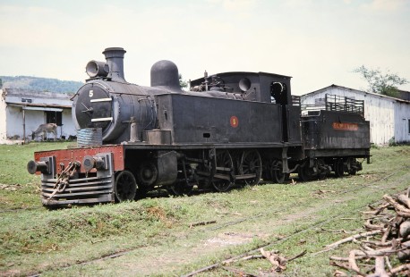 Ferrocarril Presidente Carlos Antonio López (later Ferrocarriles del Paraguay SA FEPASA) 2-6-2 steam locomotive no. 5 waits on the track next to a farmer's barn in Sapucaí, Paraguarí, Paraguay, on October 22, 1991. Photograph by Fred M. Springer, © 2014, Center for Railroad Photography and Art. Springer-ARG-PA-CHI-BO2-05-01