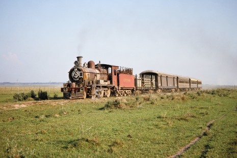 Ferrocarril Presidente Carlos Antonio López (later Ferrocarriles del Paraguay SA FEPASA) steam locomotive no. 59 pulls a 5-car train in Estancia Candelaria, Paraguay, on October 21, 1991. Photograph by Fred M. Springer, © 2014, Center for Railroad Photography and Art. Springer-ARG-PA-CHI-BO2-04-05