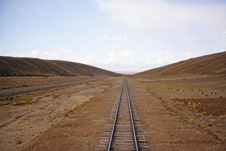 Empresa Nacional de Ferrocarriles Bolivia meter-gauge tracks lead into the horizon near Capiri, Western Bolivia, Bolivia, on September 30, 1992. Photograph by Fred M. Springer, © 2014, Center for Railroad Photography and Art. Springer-ARG-PA-CHI-BO2-13-05