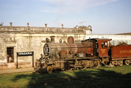 A young boy looks out from inside the Ypacarai station at Ferrocarril Presidente Carlos Antonio López (later Ferrocarriles del Paraguay SA FEPASA) steam locomotive no. 151 in Ypacaraí, Central, Paraguay, on October 22, 1991. Photograph by Fred M. Springer, © 2014, Center for Railroad Photography and Art. Springer-ARG-PA-CHI-BO2-06-06