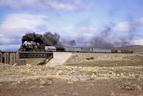 Viejo Expreso Patagónico (Old Patagonian Express) steam locomotive no. 6 hauls freight across bridge at kilometer post 335 in Lepa, Chubut, Argentina, on October 12, 1991. Photograph by Fred M. Springer, © 2014, Center for Railroad Photography and Art, Springer-PA-BR-SOAM-ME-ARG2-21-26