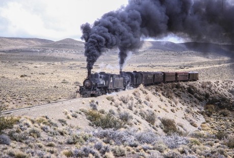 Viejo Expreso Patagónico, steam locomotives nos. 6 and 115 haul a passenger train at kilometer post 185 within the Andes mountain range in Cerro Mesa, Río Negro, Argentina, on October 14, 1991. © 2014, Center for Railroad Photography and Art, Photograph by Fred M. Springer. Springer-PA-BR-SOAM-ME-ARG2-23-34