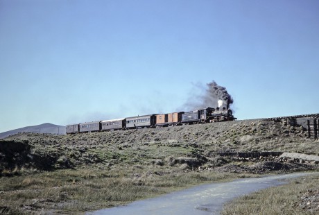 Viejo Expreso Patagónico (Old Patagonian Express) steam locomotive no. 4 leading a passenger train at kilometer post 335 in Esquel, Chubut, Argentina, on October 15, 1990.  Photograph by Fred M. Springer.  © 2014, Center for Railroad Photography and Art, Springer-SOAM1-16-37