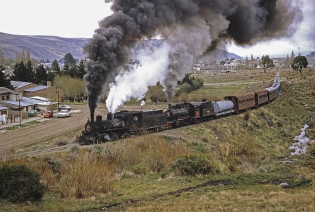 Viejo Expreso Patagónico (Old Patagonian Express) steam locomotives nos. 6 and 114 travel through Esquel, Chubut, Argentina, on October 13, 1991. Photograph by Fred M. Springer., © 2014, Center for Railroad Photography and Art, Springer-PA-BR-SOAM-ME-ARG2-22-37