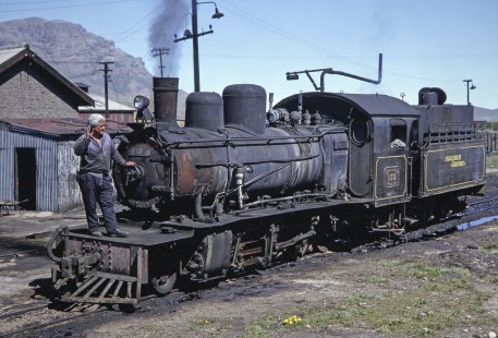 Workers and Viejo Expreso Patagónico (Old Patagonian Express) steam locomotive no. 135 at yard in El Maitén, Chubut, Argentina, on October 16, 1990. Photograph by Fred M. Springer, © 2014, Center for Railroad Photography and Art, Springer-SOAM1-17-15