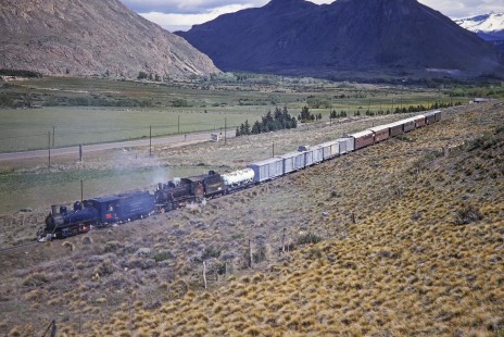 Viejo Expreso Patagónico (Old Patagonian Express) mixed freight and passenger train is led by two steam locomotives in Esquel, Chubut, Argentina, on October 30, 1995. Photograph by Fred M. Springer.  © 2014, Center for Railroad Photography and Art, Springer-CHI-ARG1-10-12